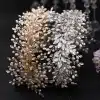 Elegant gold or silver pearl crystal wedding hair accessories headband by Braidani, featuring stunning pearls and crystals, perfect for bridal hairstyles.
