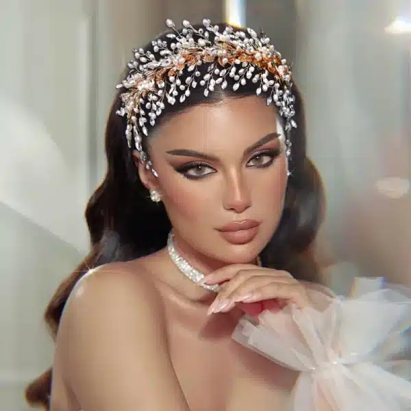 Model wearing Braidani gold pearl crystal wedding hair accessories headband, showcasing its elegant design and perfect fit for bridal hairstyles.