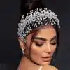 Third model view of Braidani silver pearl crystal wedding hair accessories headband, showcasing its elegant style and perfect fit for bridal hairstyles.