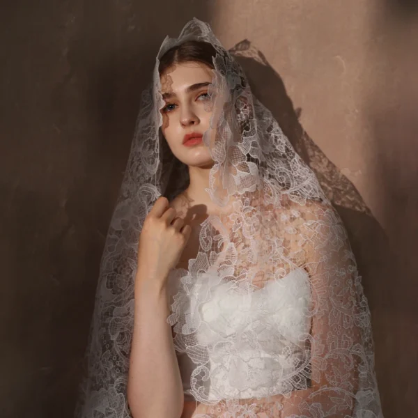 Close-up detail of Braidani long floral lace wedding veil