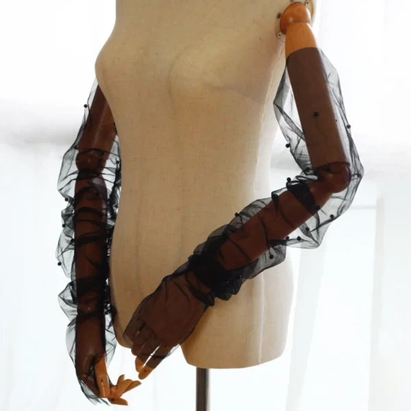 Model wearing Braidani Black lace Gloves – Elegant opera-length gloves with pearl embellishments, perfect for weddings and formal events.