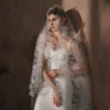 Braidani long floral lace wedding veil shown in bridal pose