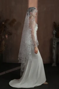 Braidani long floral lace wedding veil side view on bride